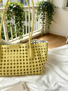 Yellow woven leather tote bag, large capacity shoulder handbag for women daily commute style.