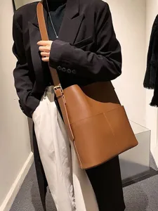 Minimalist brown leather bucket bag, chic large capacity shoulder crossbody bag for women.