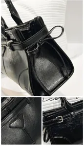 Black glossy leather women tote bag with elegant bow detail and stylish shoulder strap design.