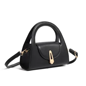 Black chic top handle crossbody bag for women with retro metal lock design, stylish.