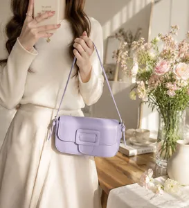 Detailed view of the light purple baguette shoulder bag with chic magnetic buckle.