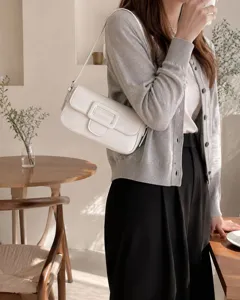Minimalist white baguette shoulder bag for women, retro chic underarm purse with elegant buckle.