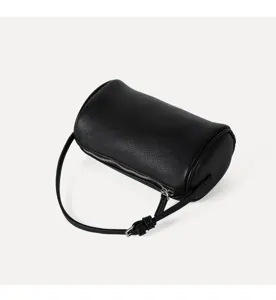 Minimalist black cylinder shoulder bag for women, chic pebbled leather crossbody bag.