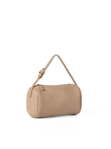 Detailed shot of beige pebble grain cylindrical crossbody bag texture, zipper and metal buckle.