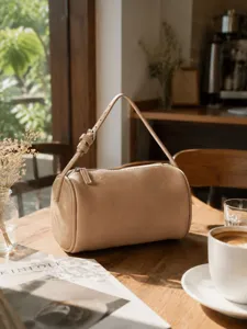 Minimalist litchi pattern leather cylinder crossbody bag, stylish women's shoulder handbag.