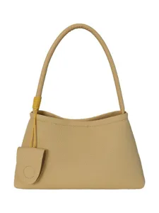 Sac à épaule minimaliste coréen pour femme, sac hobo chic avec lanière et pendentif.