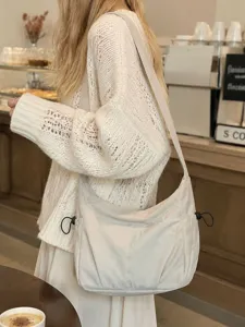 Lightweight nylon crossbody shoulder bag with large capacity and casual daily commuter style.