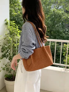 Korean style woven tote bag for women, chic brown leather shoulder bag detail view.
