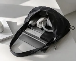Minimalist nylon hobo shoulder bag, large capacity commuter underarm tote detail view.