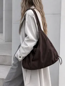 Large capacity nylon hobo shoulder bag for women, minimalist daily commuting underarm tote.