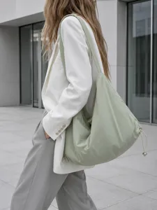 Minimalist large capacity nylon hobo shoulder bag for women, commuter underarm tote bag detail.