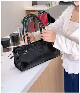 Black glossy leather tote shoulder bag for women, versatile large capacity commuter bag with top handles.