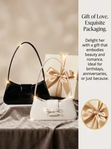 Detail shot of the elegant shoulder baguette bag featuring a delicate bow and premium finish.