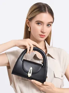 Chic black semi-circular womens handbag with metal lock, stylish retro commuting top handle bag.