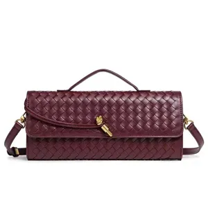Burgundy woven leather shoulder bag with top handle and chic knot detail for stylish daily wear.