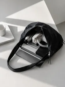 Minimalist black nylon hobo shoulder bag for women, large capacity commuter tote and handbag.