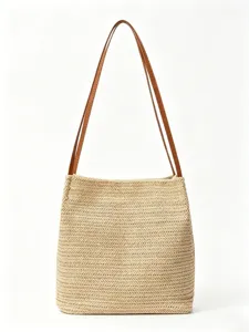 Stijlvolle geweven stro bucket tas met bruine lederen bandjes voor dames zomer casual mode.