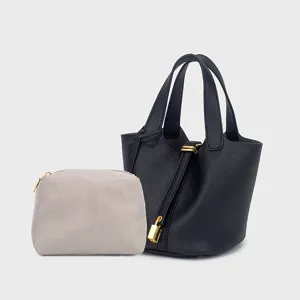 Stylish PU leather bucket bag set with matching coin pouch and lock detail for women everyday.