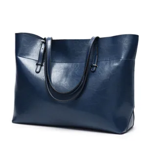 Classic dark blue leather tote bag for women, elegant large capacity shoulder handbag.