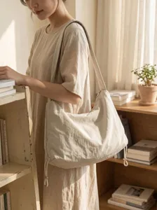Beige nylon slouchy shoulder bag large capacity casual crossbody tote for women daily commute.
