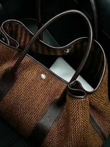 Stylish brown tweed tote bag with dark brown leather handles for women autumn winter fashion.