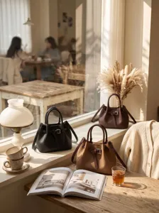 Chic leather bucket bag detail showing premium texture, adjustable strap and stylish metal buckle.