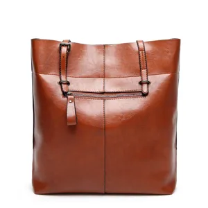 Stylish brown leather tote bag for women, perfect for daily wear and office commute use.