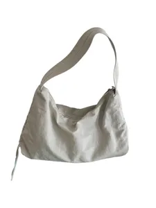 Minimalist nylon underarm shoulder bag with drawstring detail, casual large capacity tote purse.