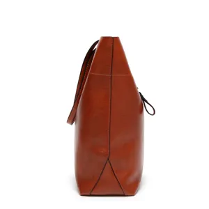 Women brown PU leather tote bag side view detail, casual minimalist shoulder handbag.