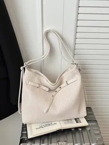 Minimalist pleated leather shoulder bag, large capacity tote for work and daily commute.