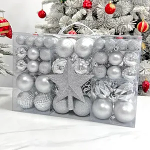 Silberne Christbaumkugeln Set mit Glitzer Kugeln und Stern Spitzen in transparenter Box.