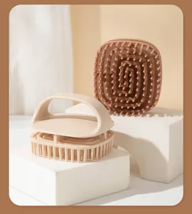 Detail view of silicone scalp massage brushes with flexible bristles and ergonomic handle.