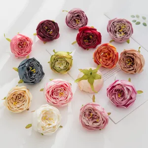 Artificial rose flower heads detail shot, colorful DIY craft decorative floral pieces.