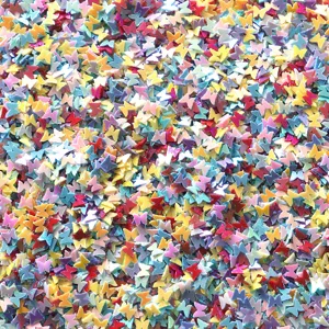 Close-up detail of colorful holeless PVC butterfly sequins for nail art and DIY craft supplies.