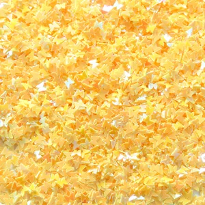 Close-up detail of bulk yellow butterfly sequins for nail art, crafts and DIY projects.