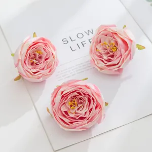 Artificial pink rose flower heads for DIY crafts, wedding decorations and floral arrangements