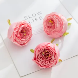 Artificial pink rose flower heads for DIY crafts, wedding decor, and floral walls.