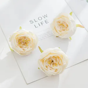 White artificial rose flower heads detail for DIY crafts wedding decoration style