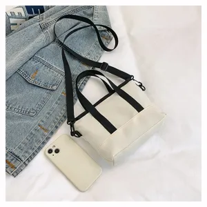 Sac cabas en toile minimaliste décontracté, sac bandoulière léger et polyvalent.