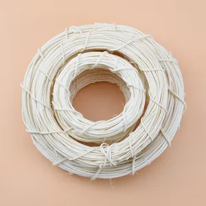 Detailed view of off-white woven rattan ring, natural floral wreath base for DIY decor.