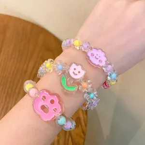 Cute jelly color transparent beaded bracelet detail showing colorful cartoon charms for kids girls.
