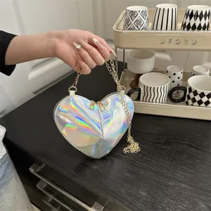 Chic holographic heart shoulder bag, shiny patent leather mini crossbody bag with gold chain strap.