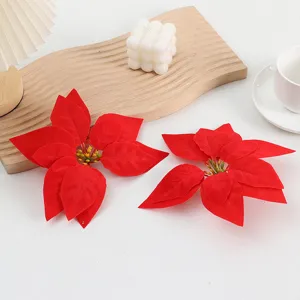 Red artificial poinsettia flower heads set, double layer floral details for Christmas decoration.