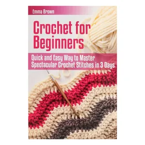 Detailed view of beginner crochet guide book cover with yarn and hook illustration.