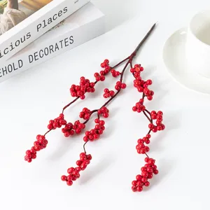 Artificial red berry branch detail, vibrant Christmas floral arrangement stem for holiday home decor.