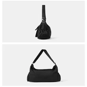 Borsa a tracolla in tela nera vista dettagliata, comoda borsa shopper stile casual.