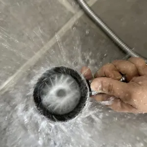 Handheld high pressure shower head with powerful massage water spray for bathroom home use.