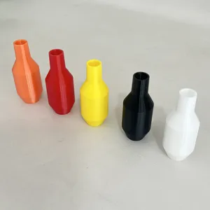 Close-up detail of multi-colored plastic siphon hose connectors and valve components for flow.