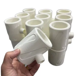 Close-up detail of white plastic shower booster component with threaded connector design.