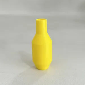 Detailed close-up view of the yellow plastic siphon hose connector accessory part.